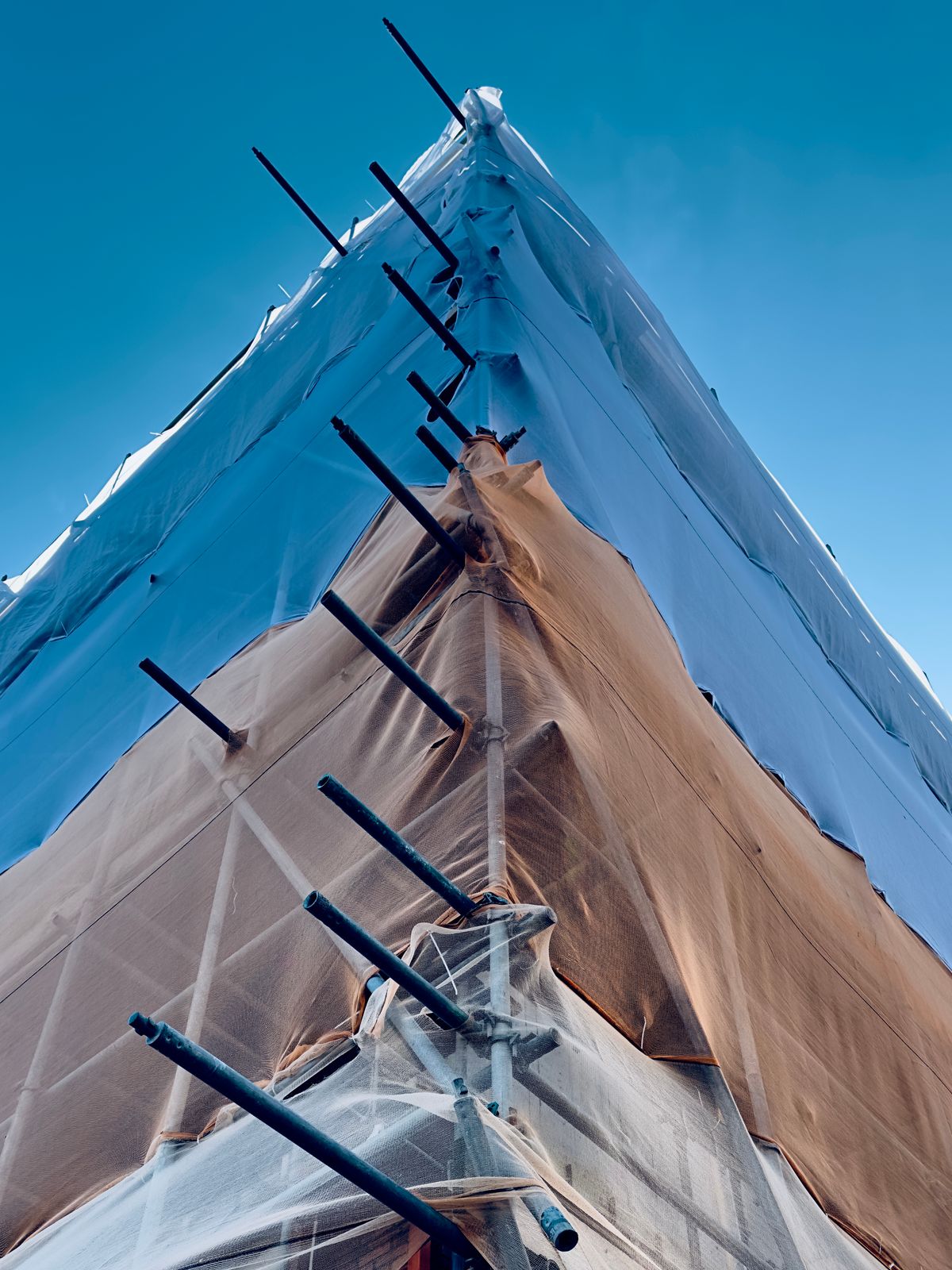 Illustrative construction site with protective sheeting