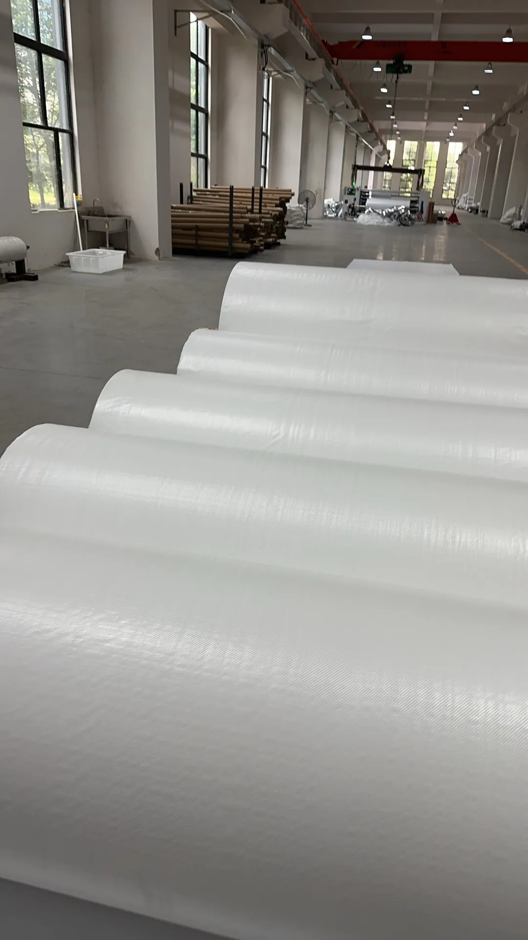 White material rolls inside the factory